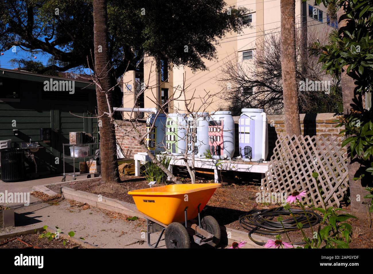 Urban Garden Resources for Plants, Some in Decorated Tanks, Wheel ...