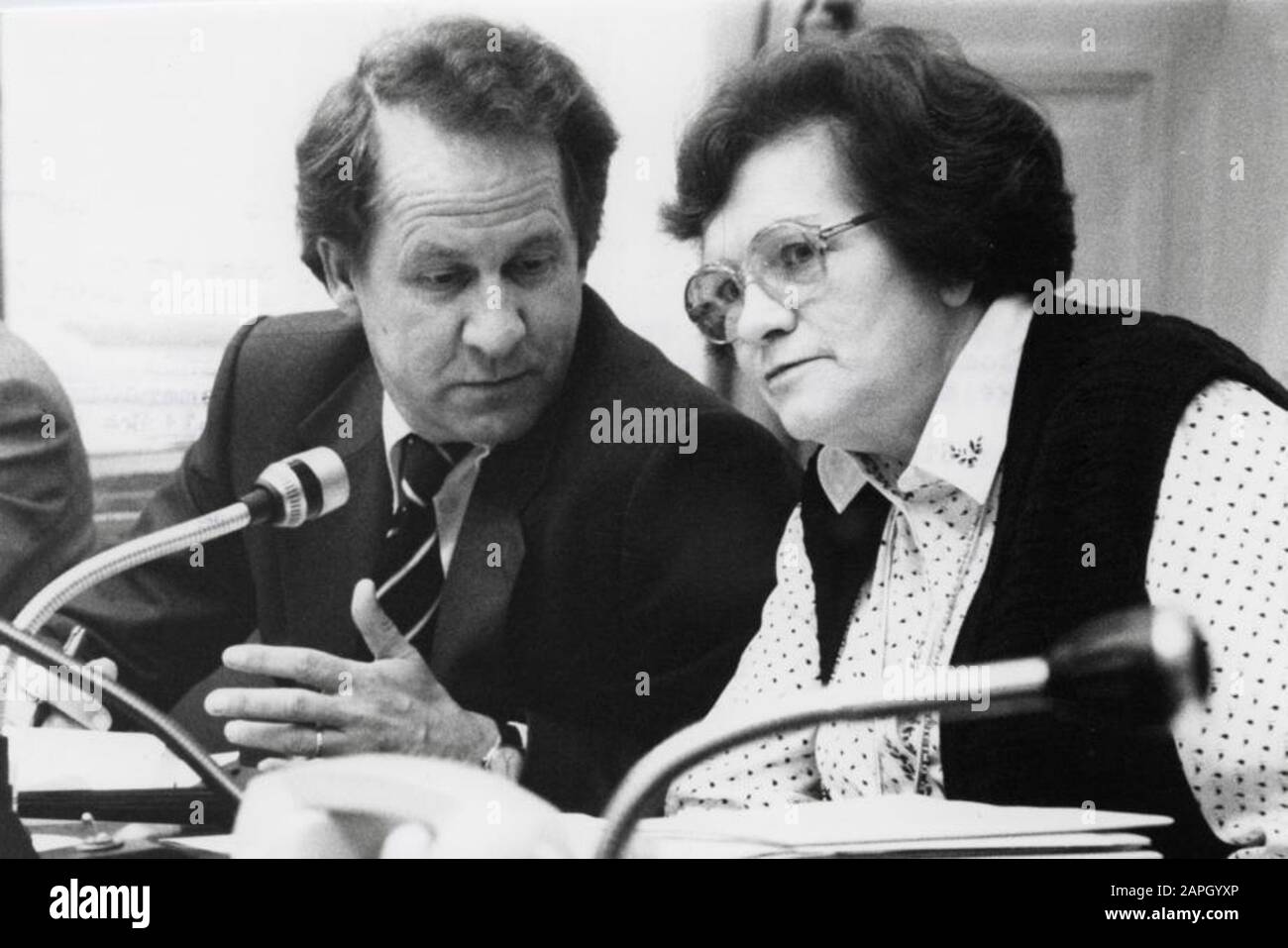 Mrs. G.M.P. Cornelissen (KVP) with Secretary of State G.Ph. Brokx during a meeting of the Chamber Committee on Housing and Spatial Planning. The Netherlands, The Hague, 27 October 1980.; Stock Photo