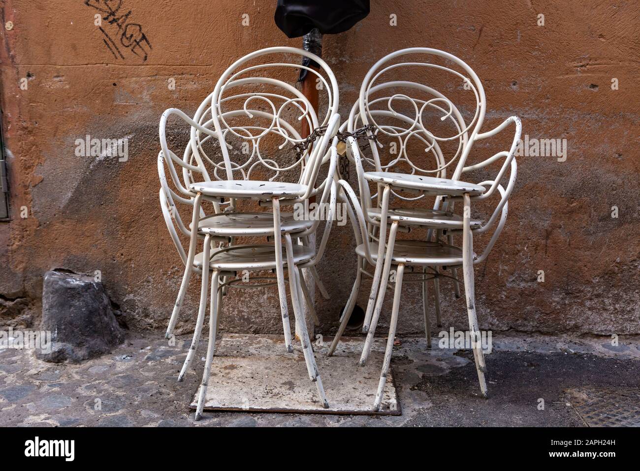 Stack of white metal chairs Stock Photo Alamy