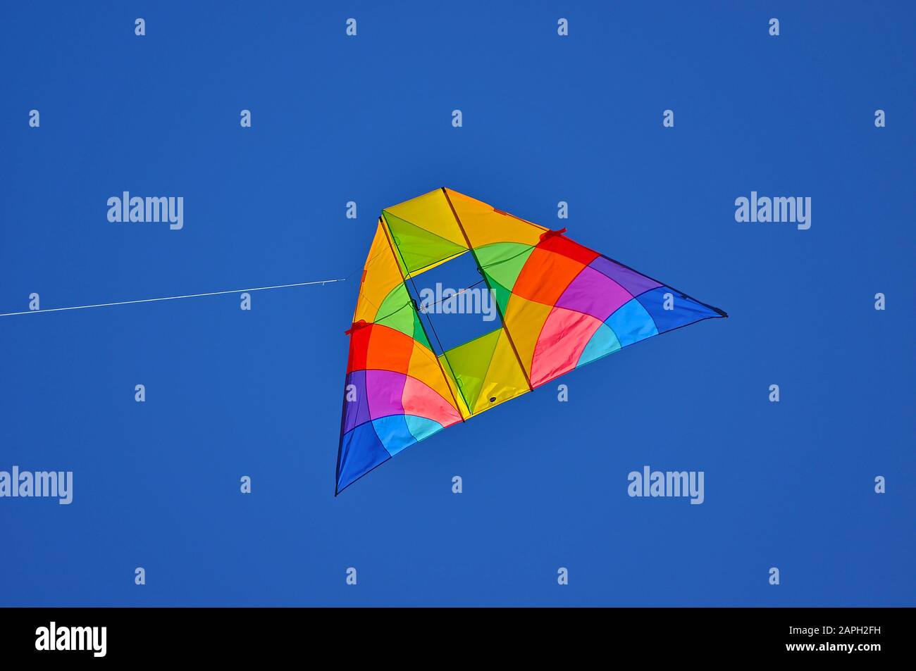 Two colorful kites flying in the blue sky Stock Photo
