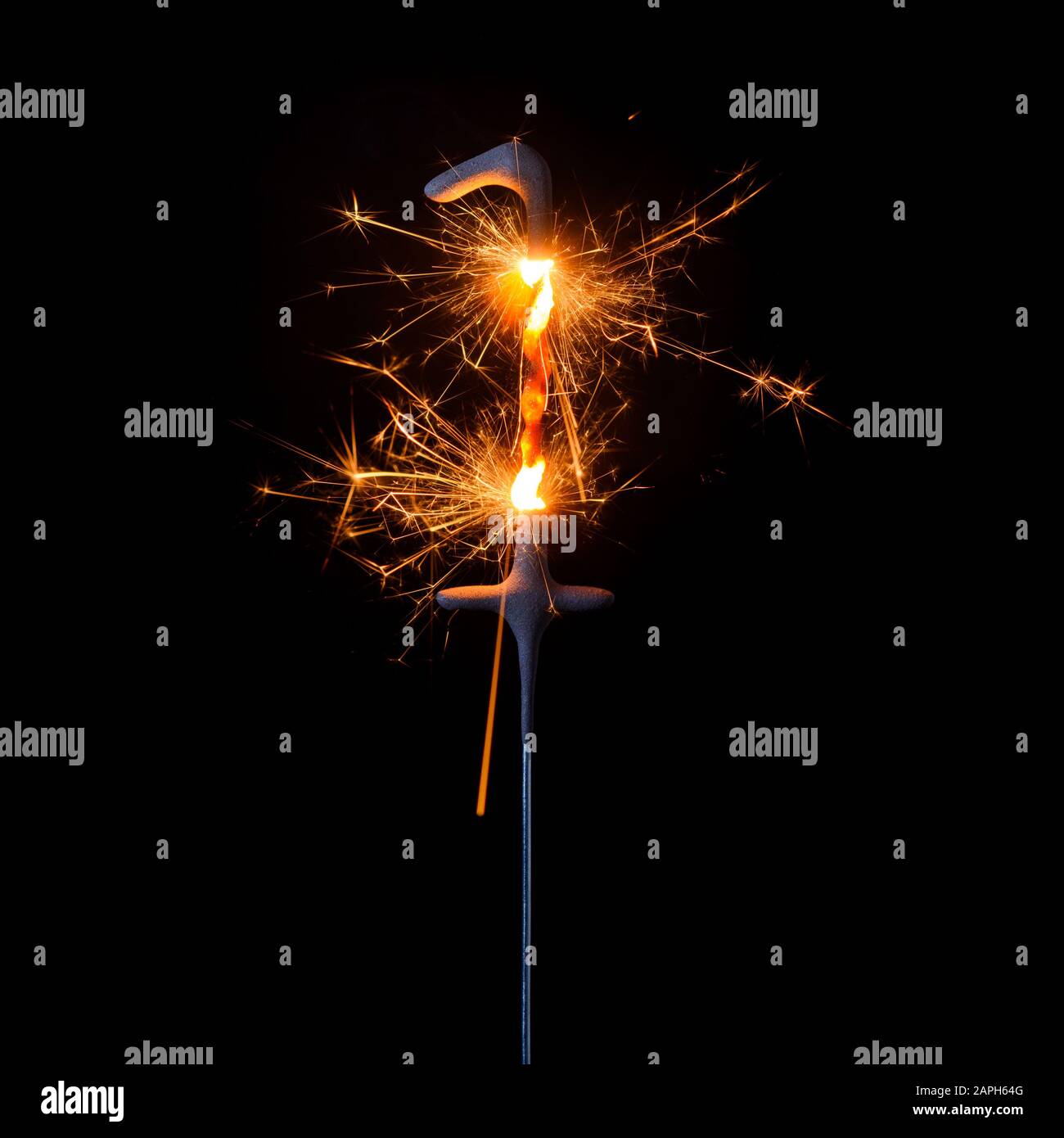 Burning sparkler in shape of number one, digit 1, isolated on black background. Stock Photo