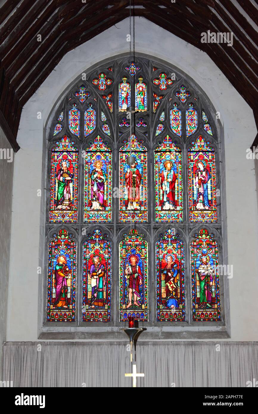 Stained glass east window in chancel of St Mildreds church , Tenterden