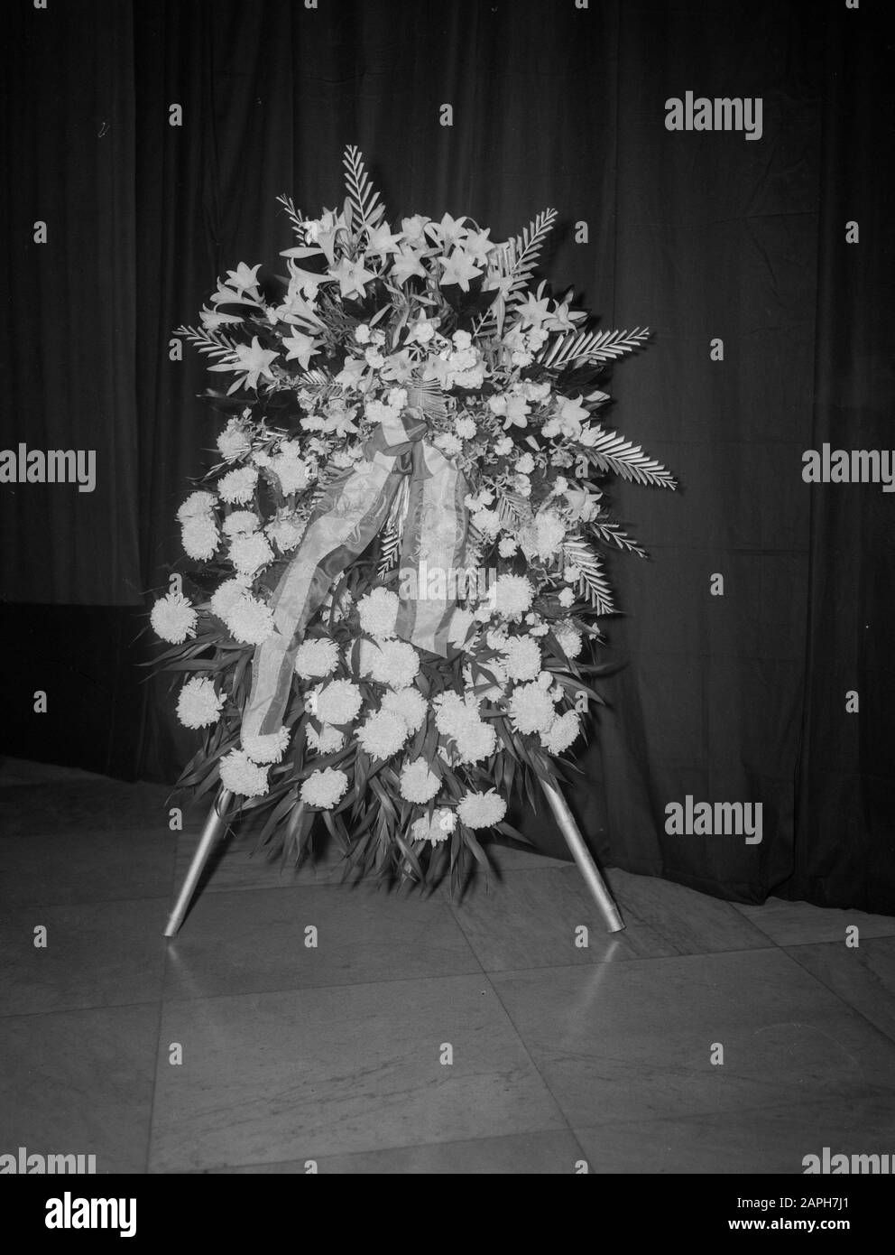 Burial General Rail Description: The funeral of General S.H. Rail. The flower arrangement of H.M. de Koningin Juliana and H.H. Prins Bernhard Date: 28 May 1949 Location: Indonesia, Dutch East Indies Stock Photo