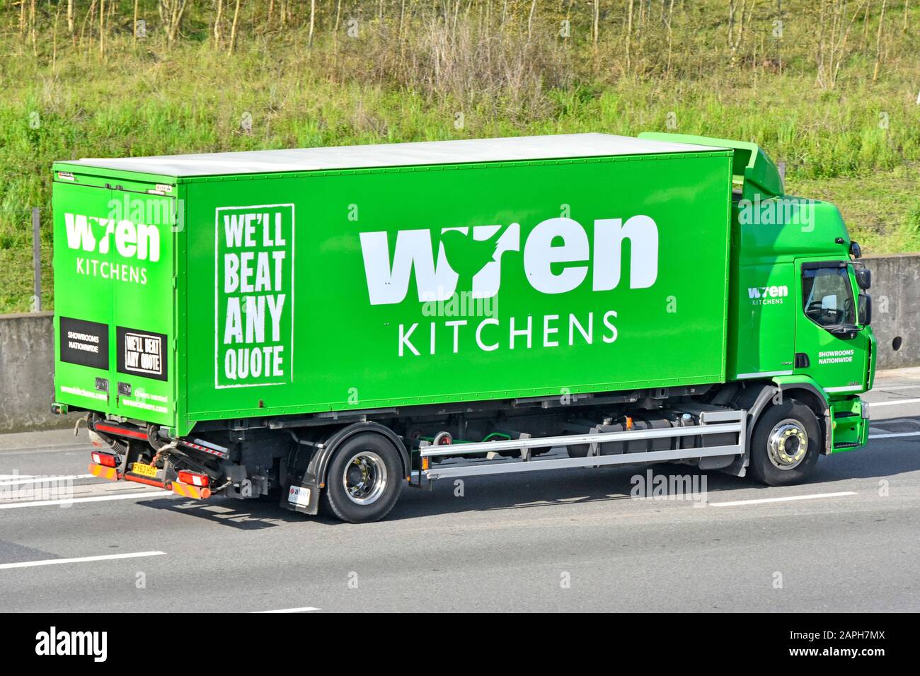 Wren Kitchens British designer manufacturer & retail business selling from showrooms side back of lorry truck advertising brand driving on uk motorway Stock Photo