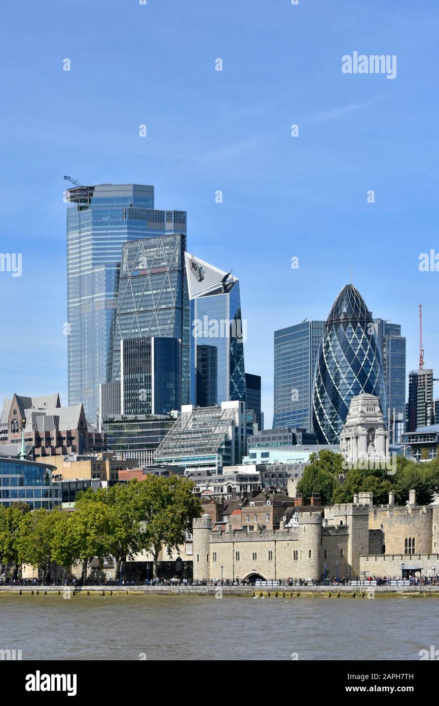 Old & new in cityscape image of skyscraper building construction 2019 in city square mile business district River Thames Tower of London England UK Stock Photo