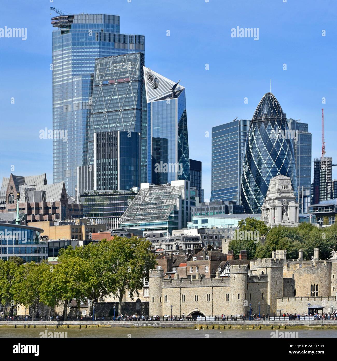 Old & new in cityscape image of skyscraper building construction 2019 in city square mile business district River Thames Tower of London England UK Stock Photo