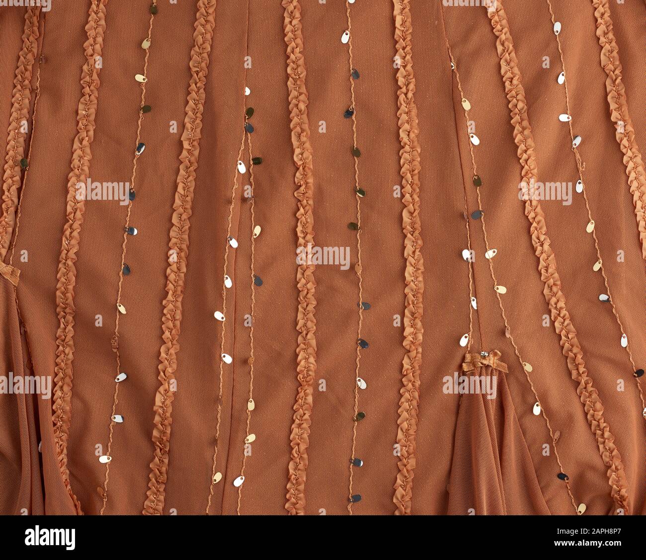 brown tulle with sequin embroidery and decor, textile for sewing clothes, full frame Stock Photo