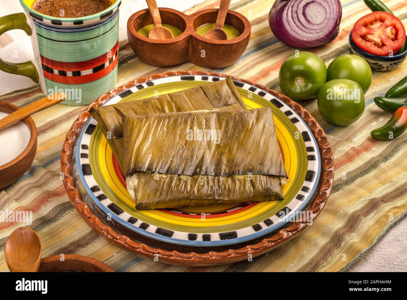 Tamales Oaxaqueños, Mexican dish made with corn dough, chicken or pork and  chili, wrapped in a banana leaves Stock Photo - Alamy, image size:1300x957