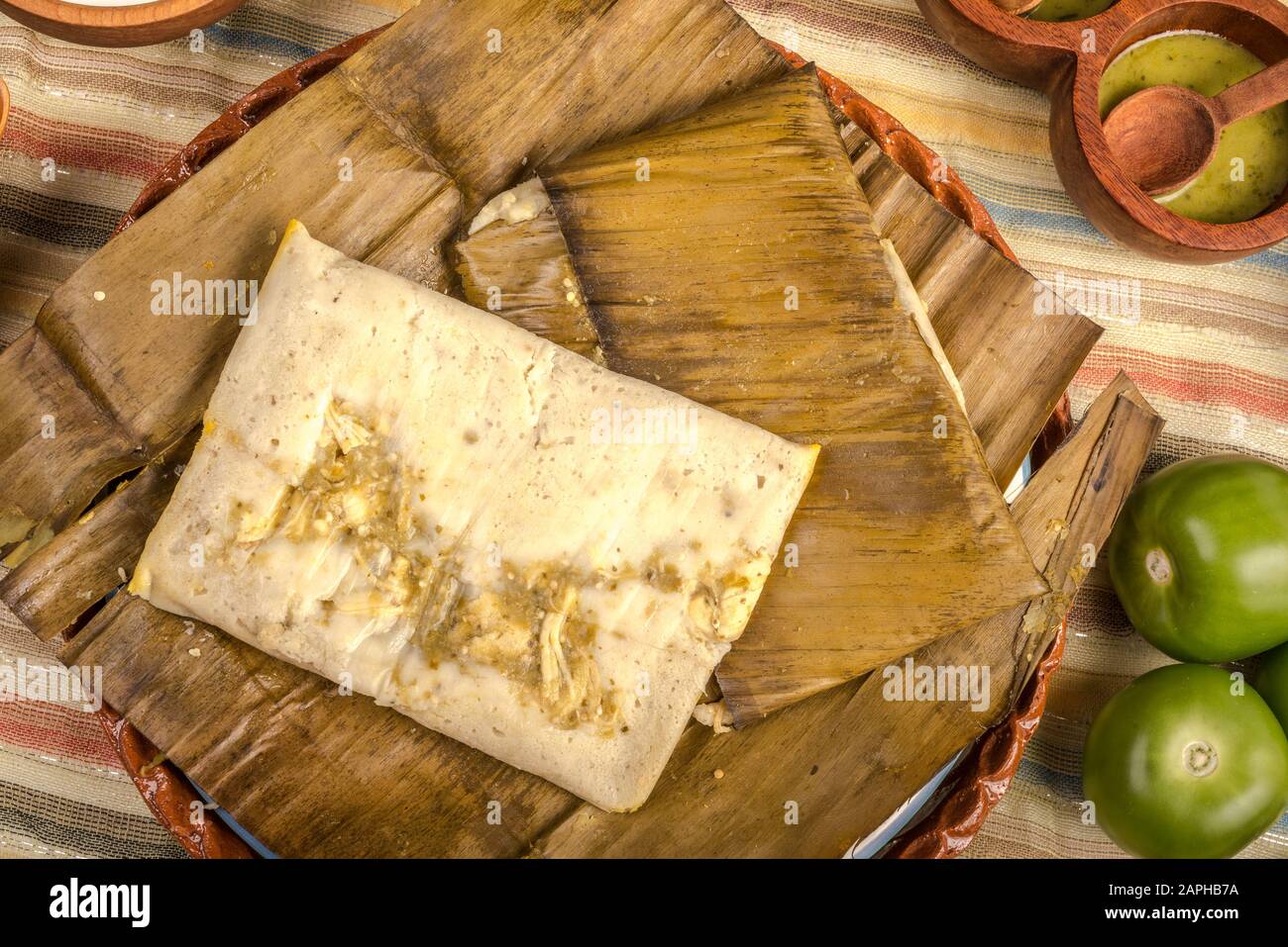 Tamales Oaxaqueños, Mexican dish made with corn dough, chicken or pork and  chili, wrapped in a banana leaves Stock Photo - Alamy, image size:1300x957