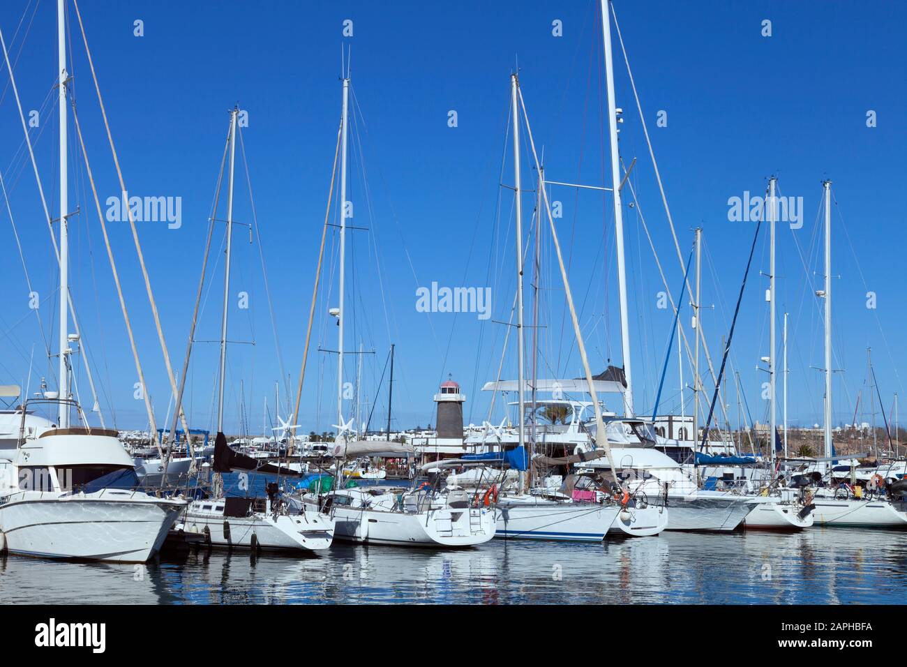 Variety of yachts, sail and motor boats mooring in a harbor , Stock Photo