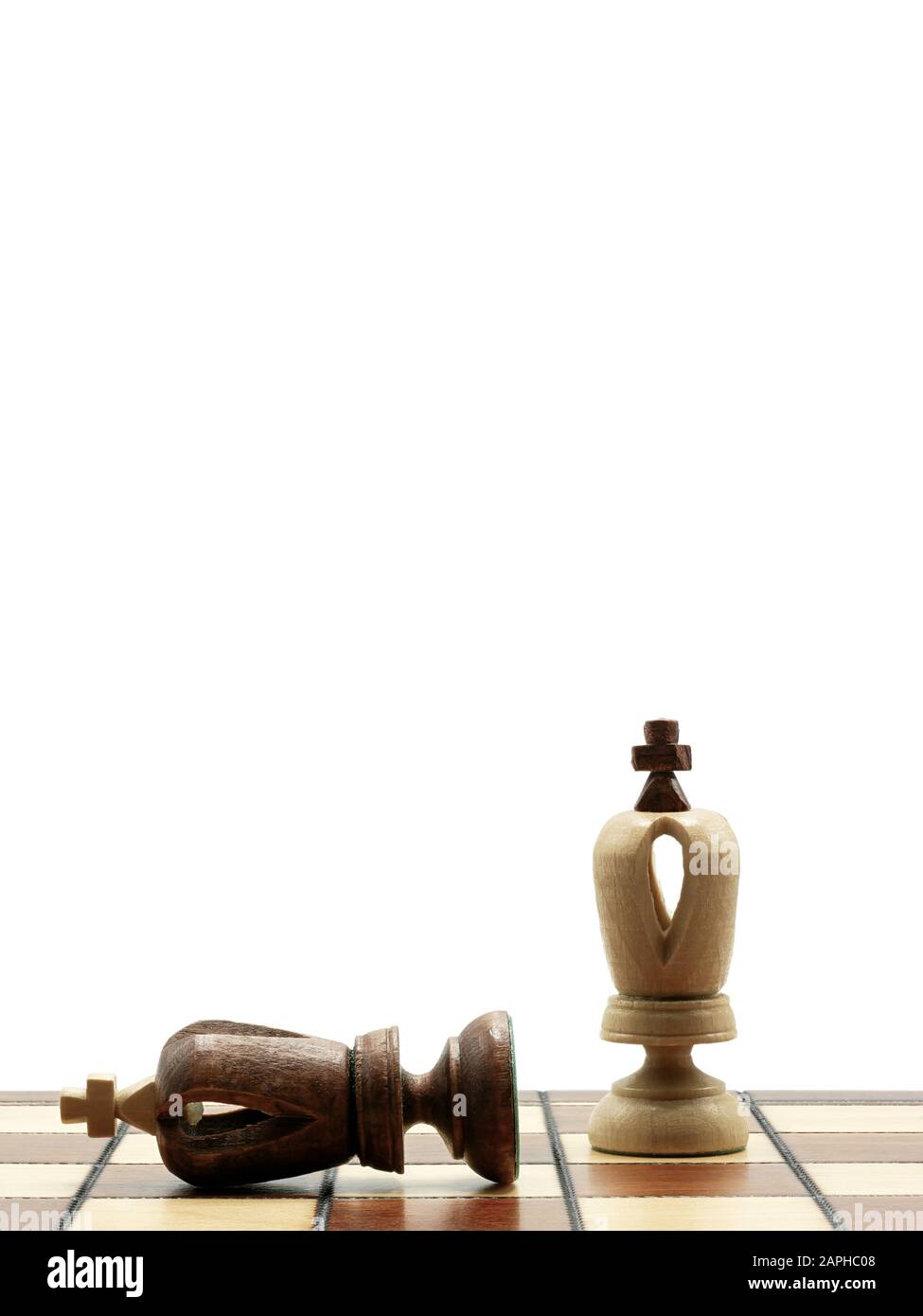 Defeated Black King Chess Piece Lying Next To A Standing White King