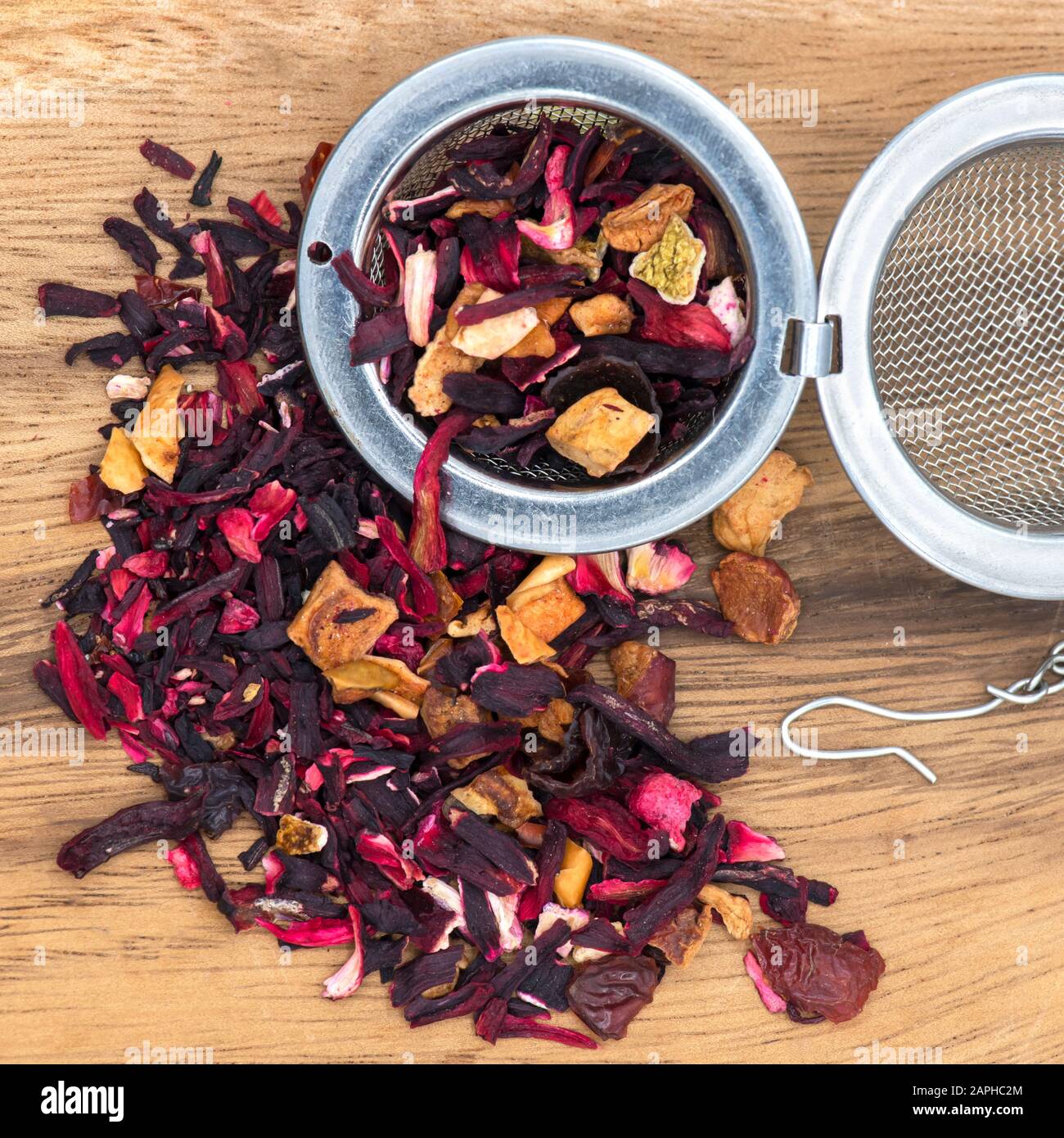 square fruit infused red berry tea with orange and apple peel , wooden ...