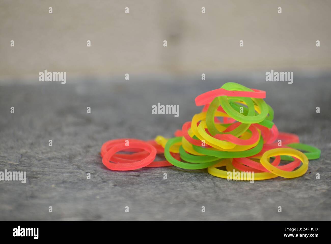 Colorful rubber bands in black background. Stock Photo