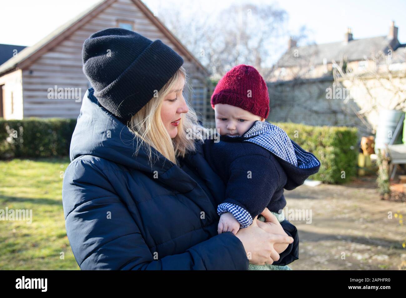 Mother holding her son in her arms hi-res stock photography and images ...
