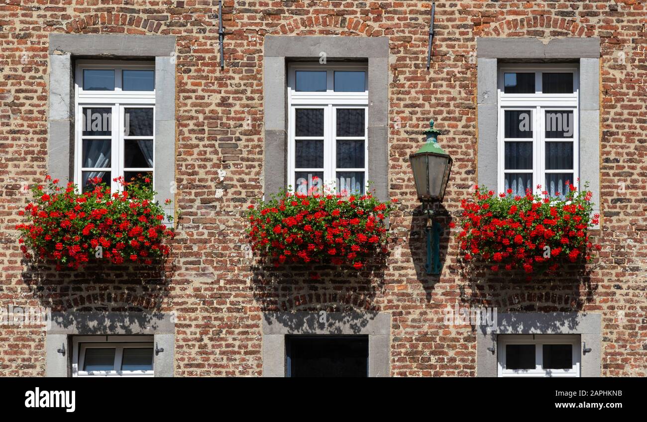 Detail Of Brick House With Beautiful Red Flower Boxes Outside In Aachen Germany Stock Photo Alamy