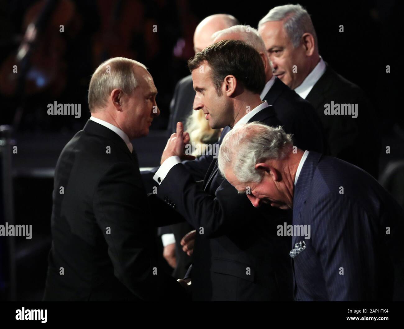Jerusalem, Israel. 23rd Jan, 2020. Russian President Vladimir Putin (L) talks with French President Emmanuel Macron (2-R) next to Britain's prince Charles (R) the Prince of Wales during the Fifth World Holocaust Forum at the Yad Vashem Holocaust memorial museum in Jerusalem, Israel, on Thursday, January 23, 2020. World leaders are marking the 75th anniversary of the liberation of the Nazi extermination camp Auschwitz. Pool Photo by Abir Sultan/UPI Credit: UPI/Alamy Live News Stock Photo