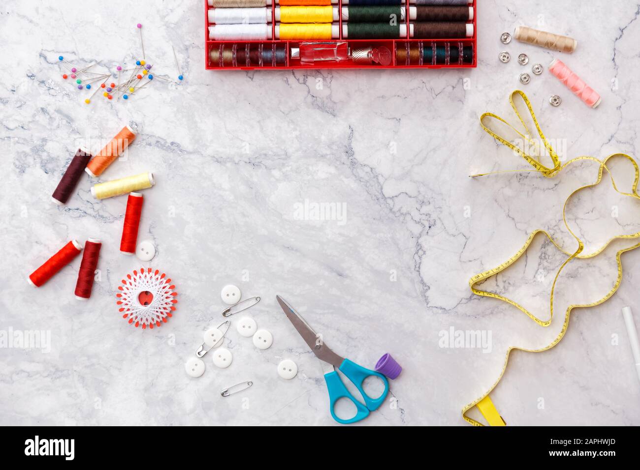 colorful sewing and tailoring tools and items on light background Stock ...