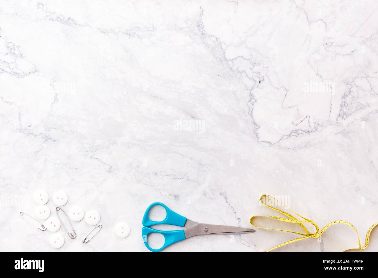 colorful sewing and tailoring tools and items on light background Stock Photo