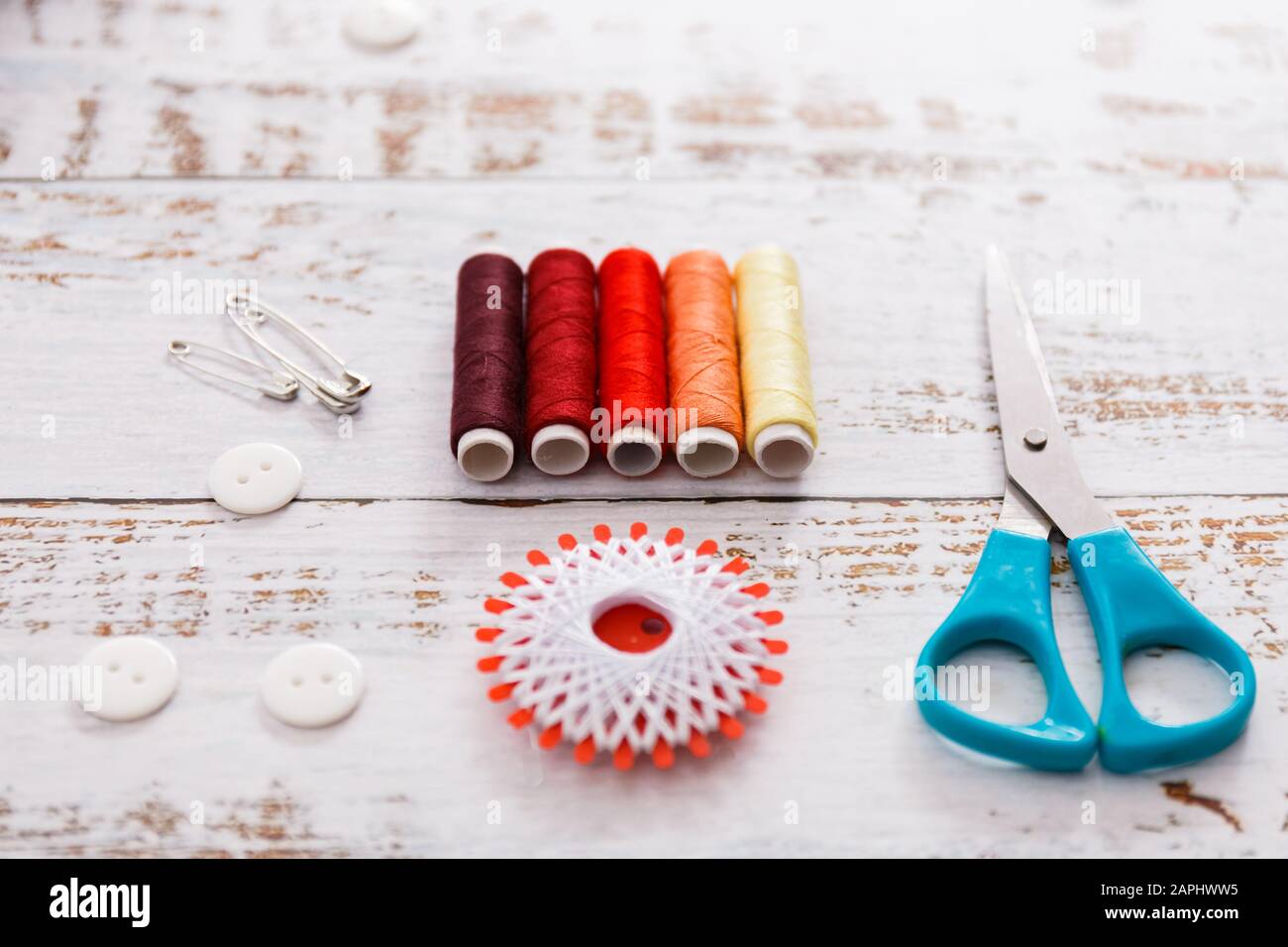 colorful sewing and tailoring tools and items on light background Stock ...