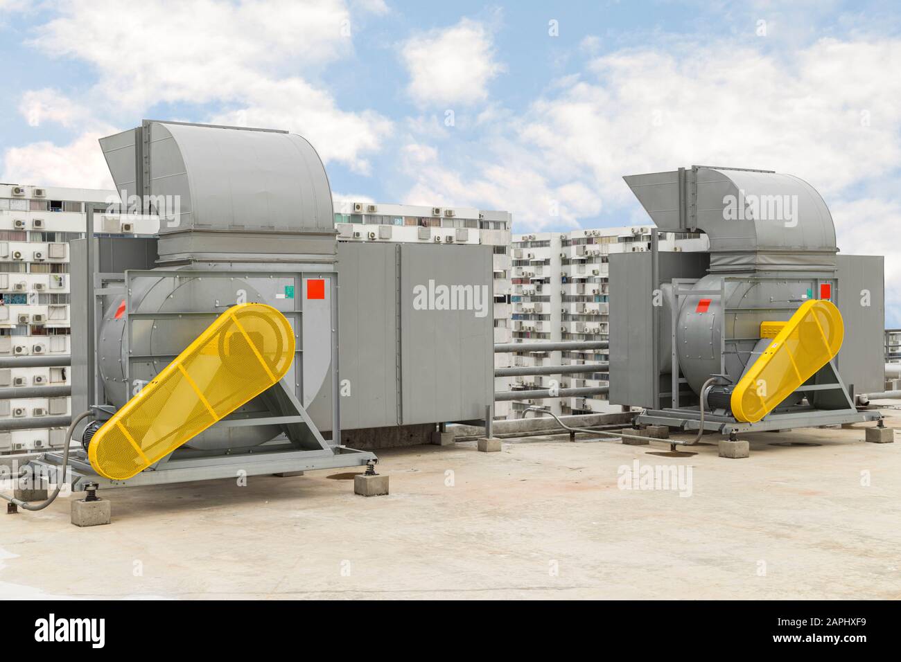 Industrial centrifugal fan and Exhaust vents of industrial air conditioning in ventilation systems. Skyscraper roof top from high building. Stock Photo