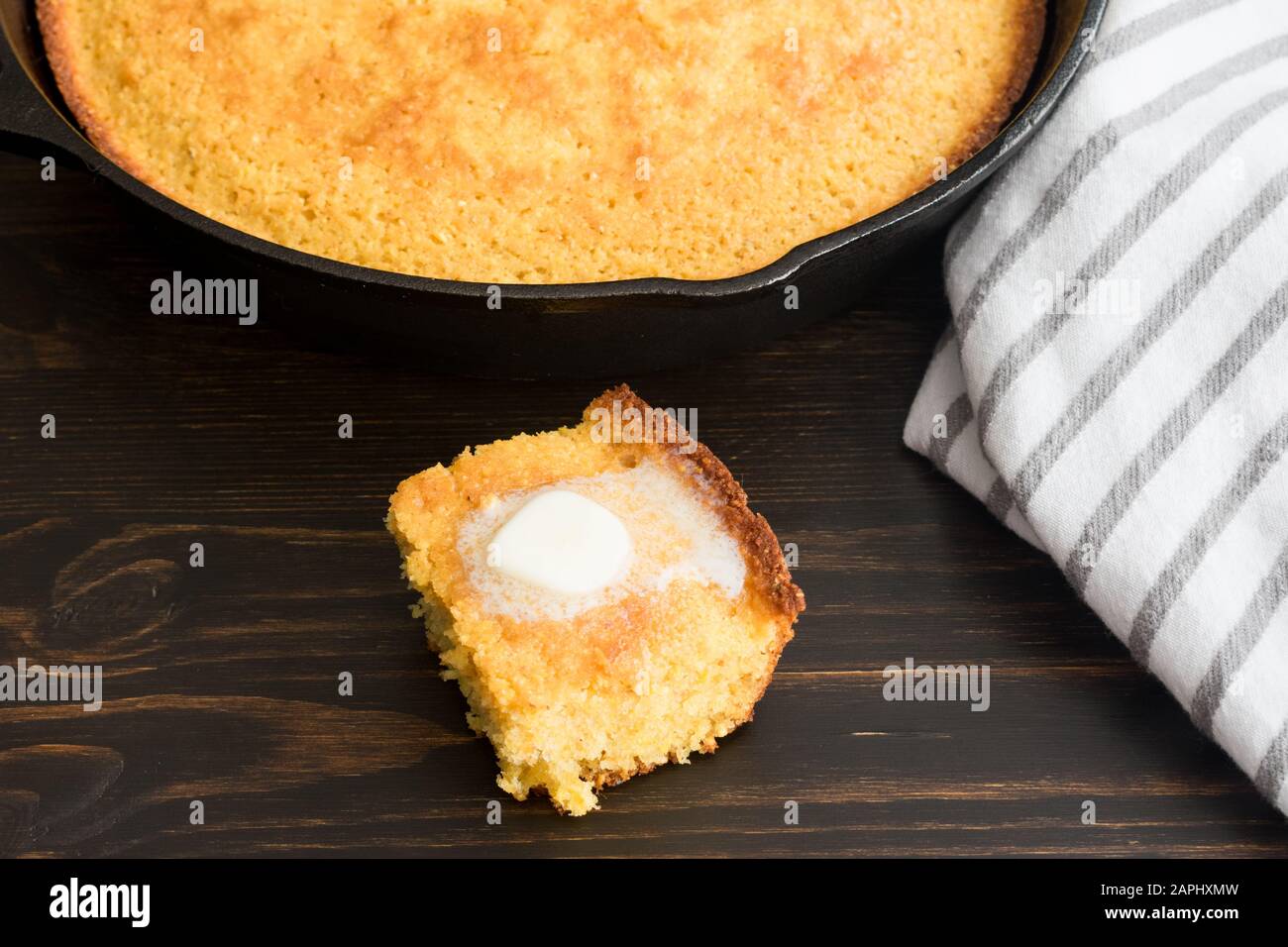 Slice of Buttermilk Cornbread with Butter: A piece of traditional Southern cornbread with a pat of melting butter Stock Photo
