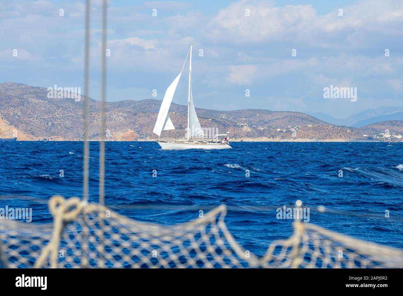 Sailing Yacht On The Background Of The Mediterranean Coast View From The Side Of Another Yacht 