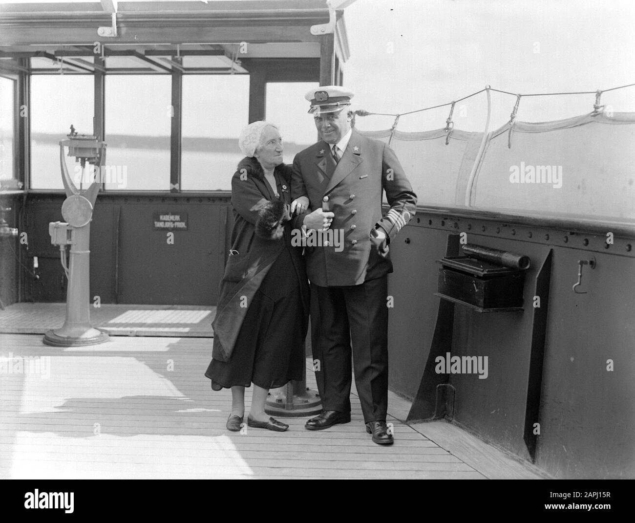 Sea voyage with MS Johan van Oldenbarnevelt to Norway Description: The actor Esther de Boer-van Rijk and Captain Julsing on the bridge Annotation: The actor Esther de Boer-van Rijk became known by her role as Kneertje in Herman Heijermans' play On hope of blessing Date: 1933 Location: Norway Keywords: actors, bridges, cruises, cruise ships, headgear, captains, passenger ships, travelers, ships, tourism, uniforms, women, sailors Personal name: Boer-van Rijk, Esther de , Heijermans, Herman, Julsing, [...] Stock Photo