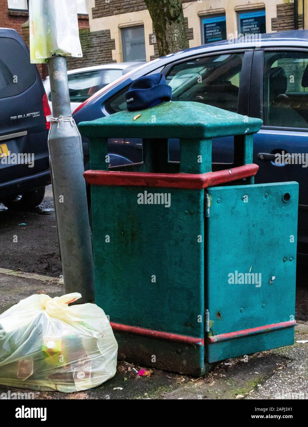 Street litter bin and waste bag, Cardiff, UK Stock Photo Alamy