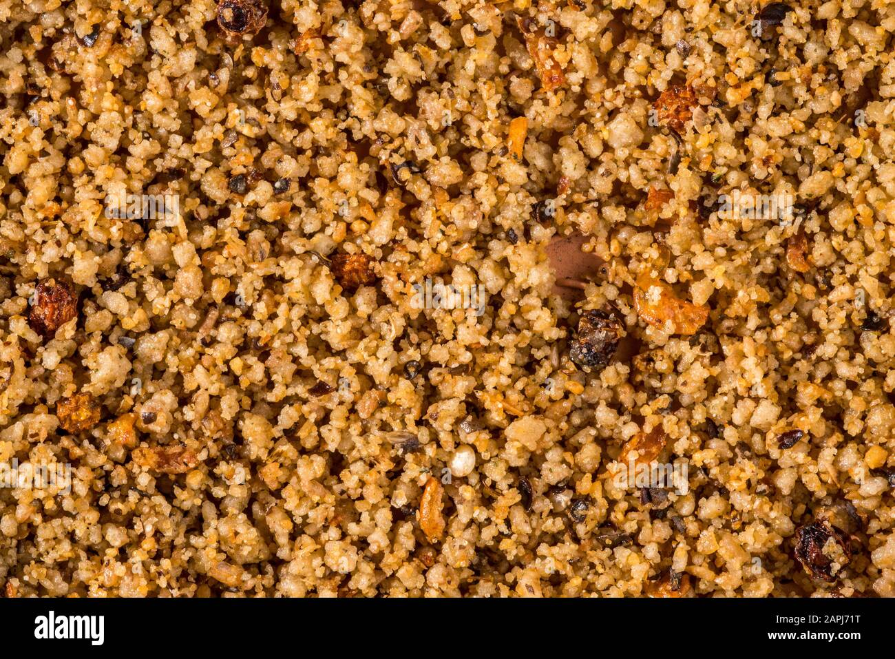 Close-up of healthy winter bird food patee for frugivorous and insectivorous garden birds containing seeds, fruits, insects and minerals Stock Photo