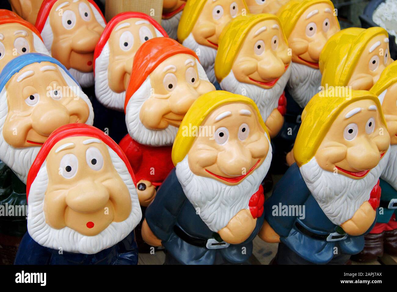 Display of garden gnomes with one with an expression of shock. Stock Photo