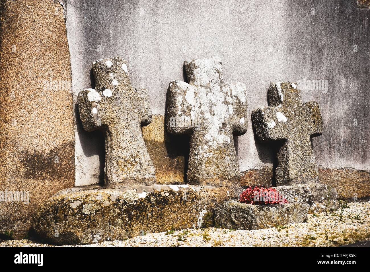 Stone crosses in front of a chapel in the Bretagne, France Stock Photo