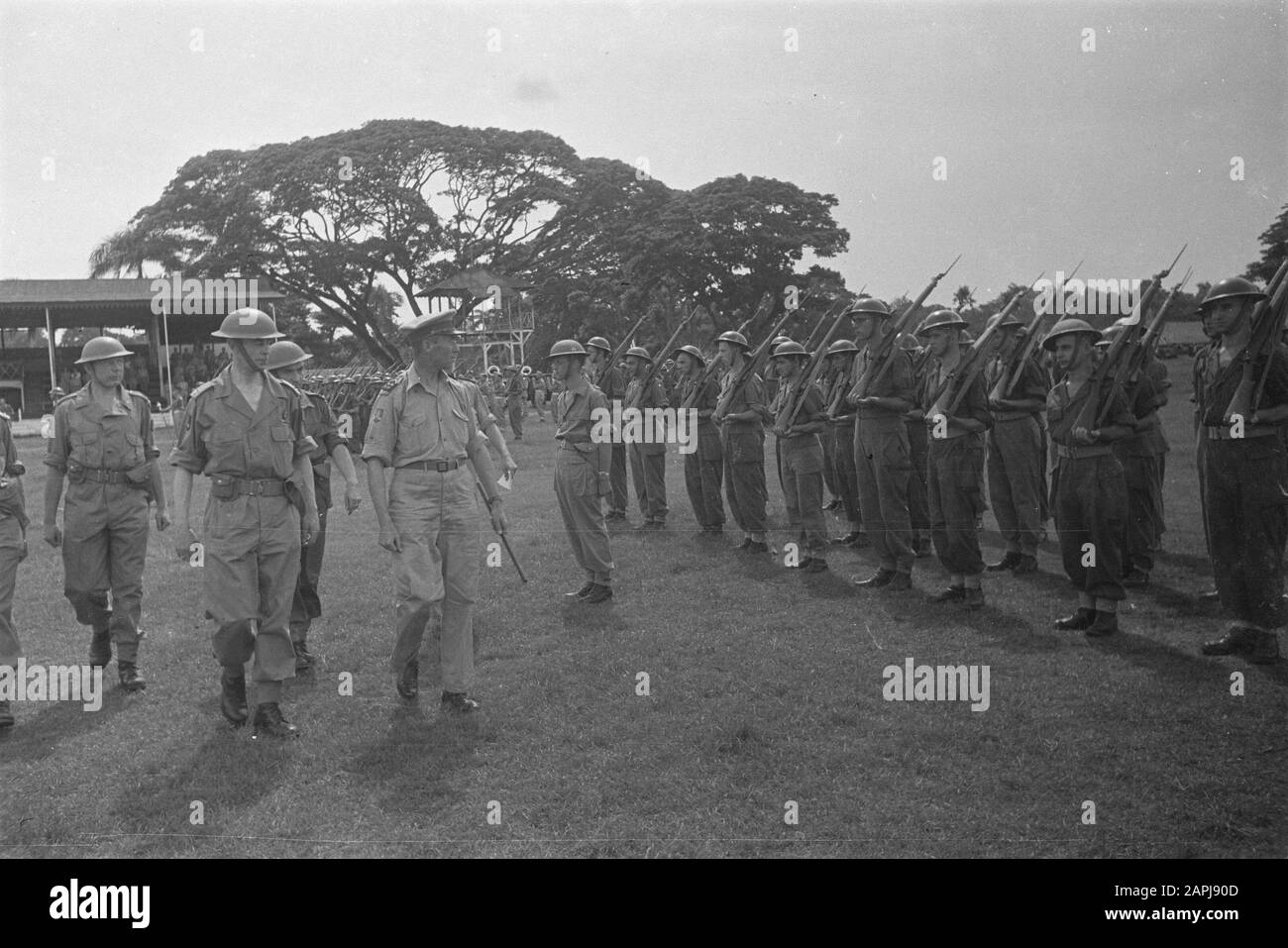 Sworn in by officers of the 7 December Division at the Royal Square in Batavia Description: Defilé. General Dürst Britt in company of parade commander inspects the troops Date: 7 December 1946 Location: Batavia, Indonesia, Jakarta, Dutch East Indies Stock Photo