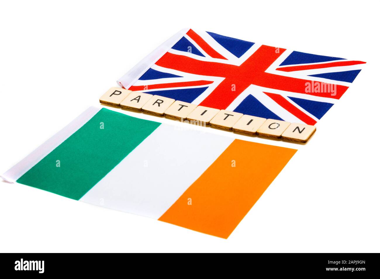 The national flag of the United Kingdom and the Republic of Ireland on a white background with a sign reading Partition Stock Photo
