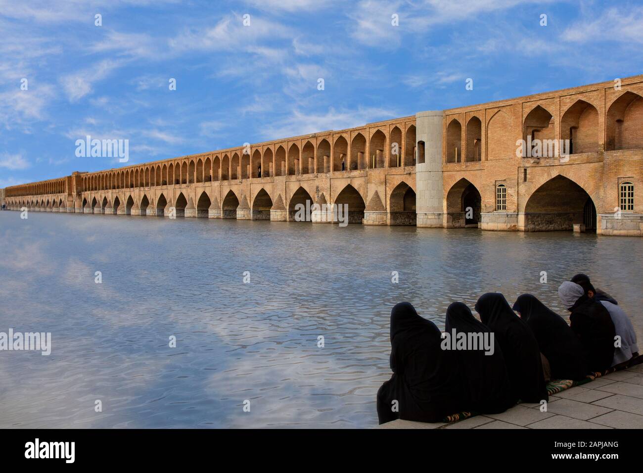 Historical Siosepol Bridge and local women in Isfahan, Iran Stock Photo