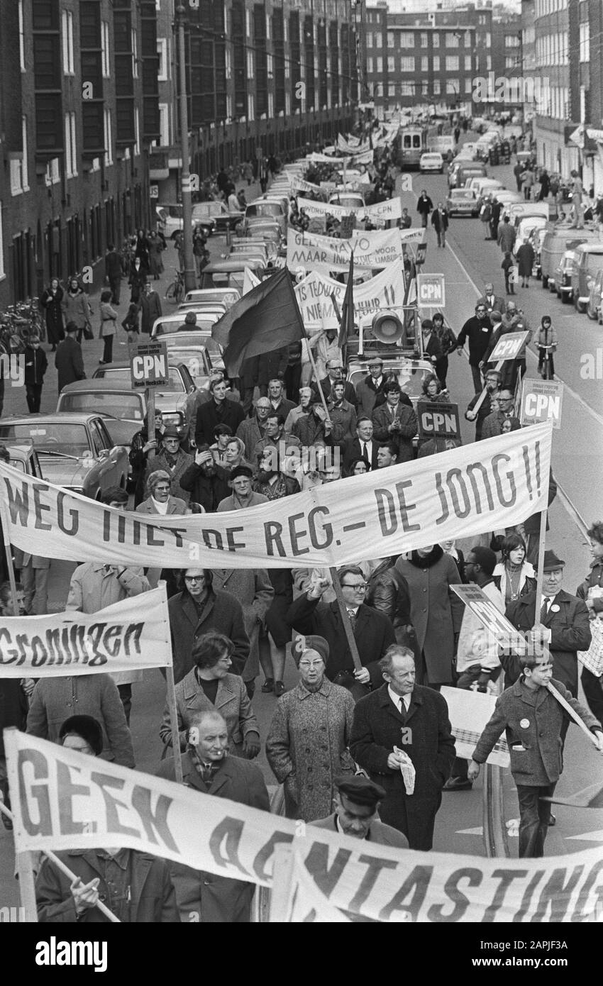 Demonstrative parade in Amsterdam by the Communist Party Description: Protesters draw flags and banners through the streets of Amsterdam Date: March 27, 1971 Location: Amsterdam, Noord-Holland Keywords : demonstrations, banners, flags Settings Name: CPN Stock Photo