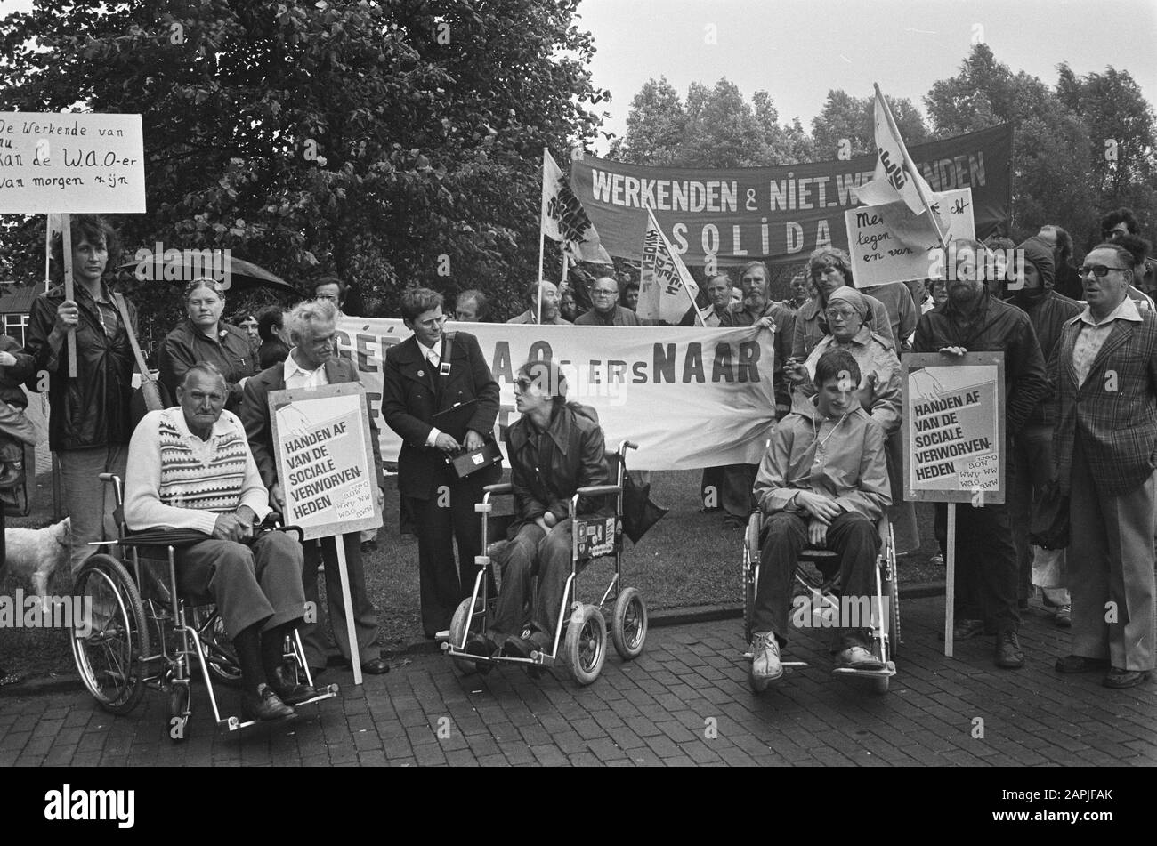 Protest of WAOers for the Joint Administration Office building in Amsterdam against austerity plans Description: demonstrators, cuts, disability, wheelchairs, banners Date: September 10 1980 Location: Amsterdam, Noord-Holland Keywords: incapacity for work, cuts, protesters, wheelchairs, banners Stock Photo