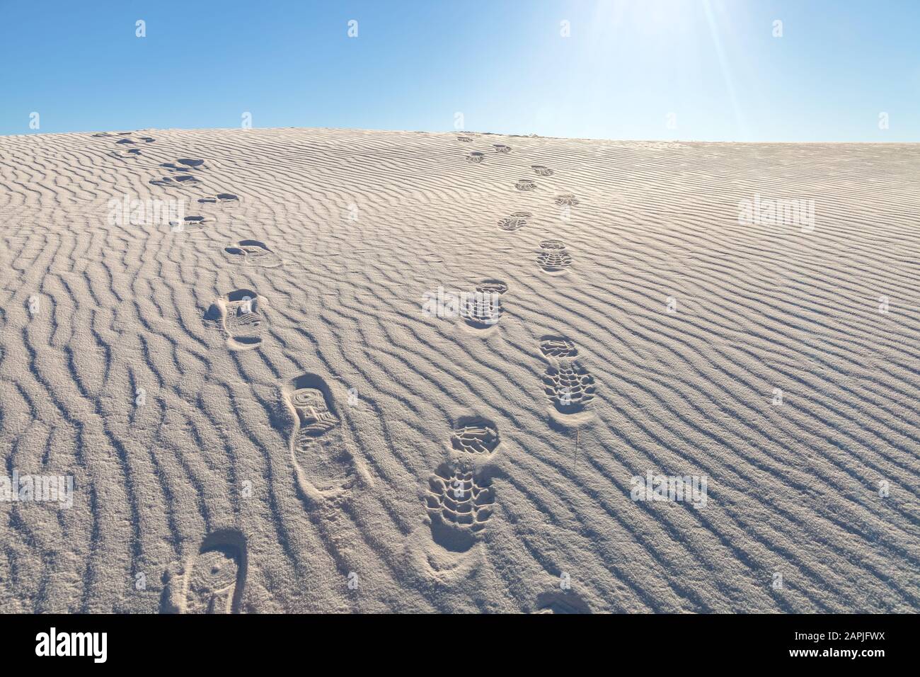 Foot prints on the sand dunes at White Sand National Monument, New Mexico, United States. Stock Photo