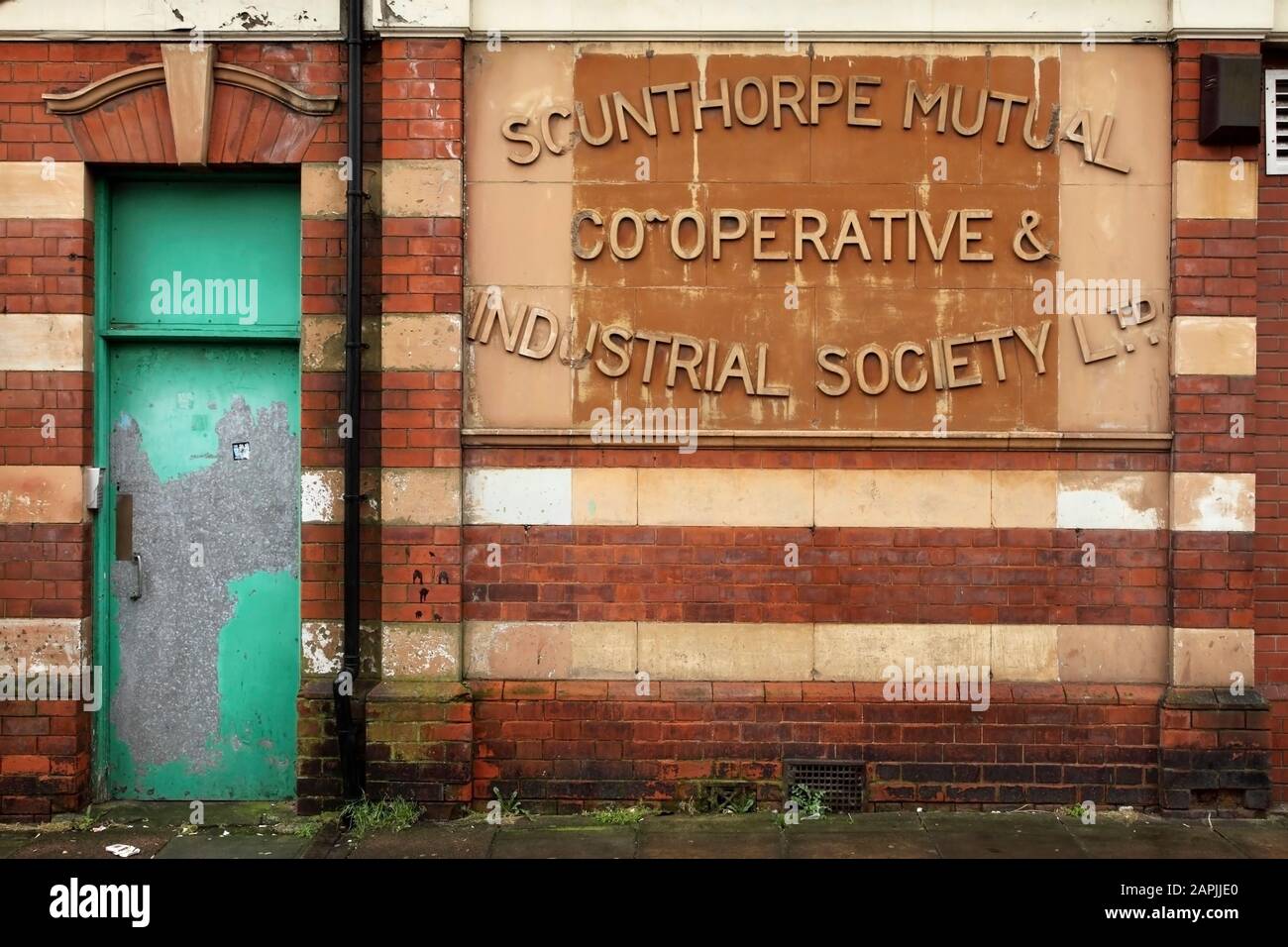 Stone sign on the side of the Scunthorpe Mutual Co-Operative and Industrial Society building, Frodingham Rd, Scunthorpe, UK. Stock Photo