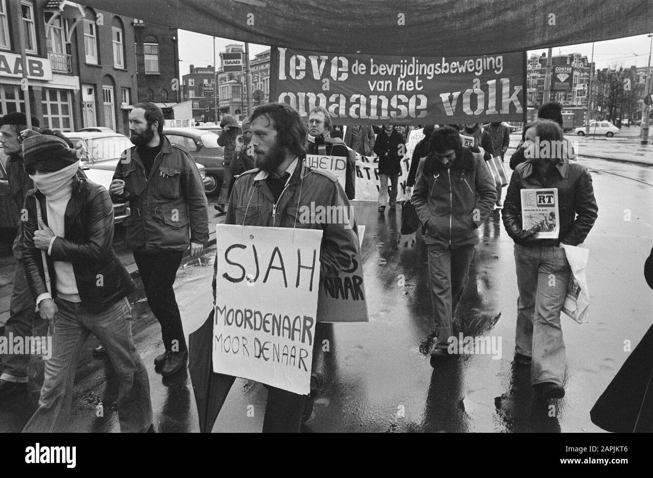 Demonstration against death sentences in Iran, in Amsterdam; protesters, left masked Iranian student Date: January 24, 1976 Location: Amsterdam, Iran Keywords: demonstrators, demonstrations, Students Stock Photo