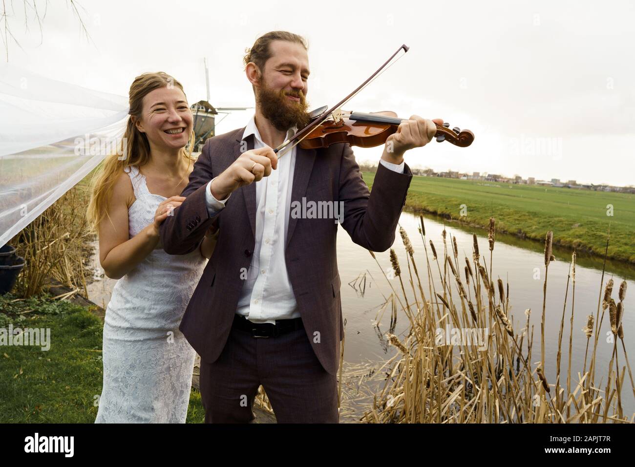 Loving couple bride and groom in wedding clothes Stock Photo