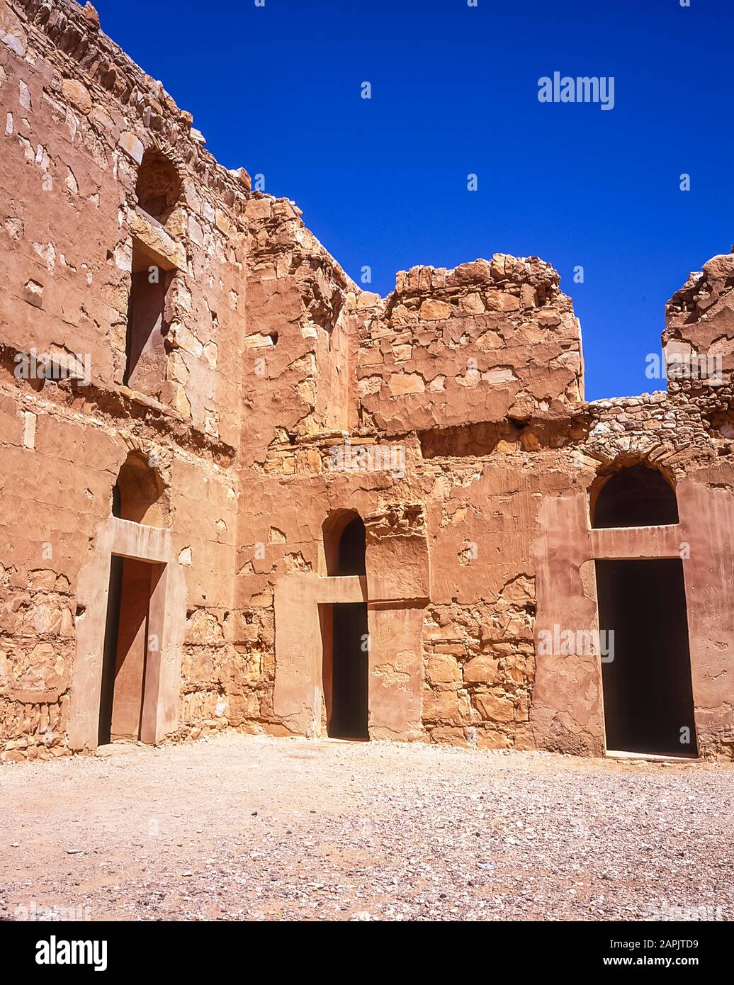 Jordan. The renovated site of the Qasr Al Kharanah caravanserai fortress. Hotel and place of sanctuary on the ancient Silk Route established across the Middle East. The fortress is perhaps the best preserved, restored castle in Jordan. Stock Photo
