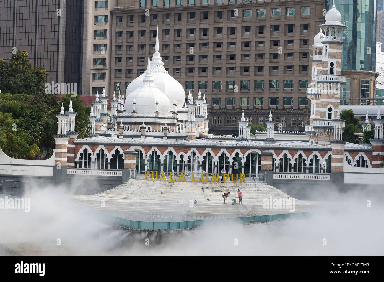 Masjid Jamek Mosque, Kuala Lumpur, Malaysia: 31 March 2019: Masjid Jamek Mosque at junction of Gombak and Klang rivers with mist effect show. Stock Photo