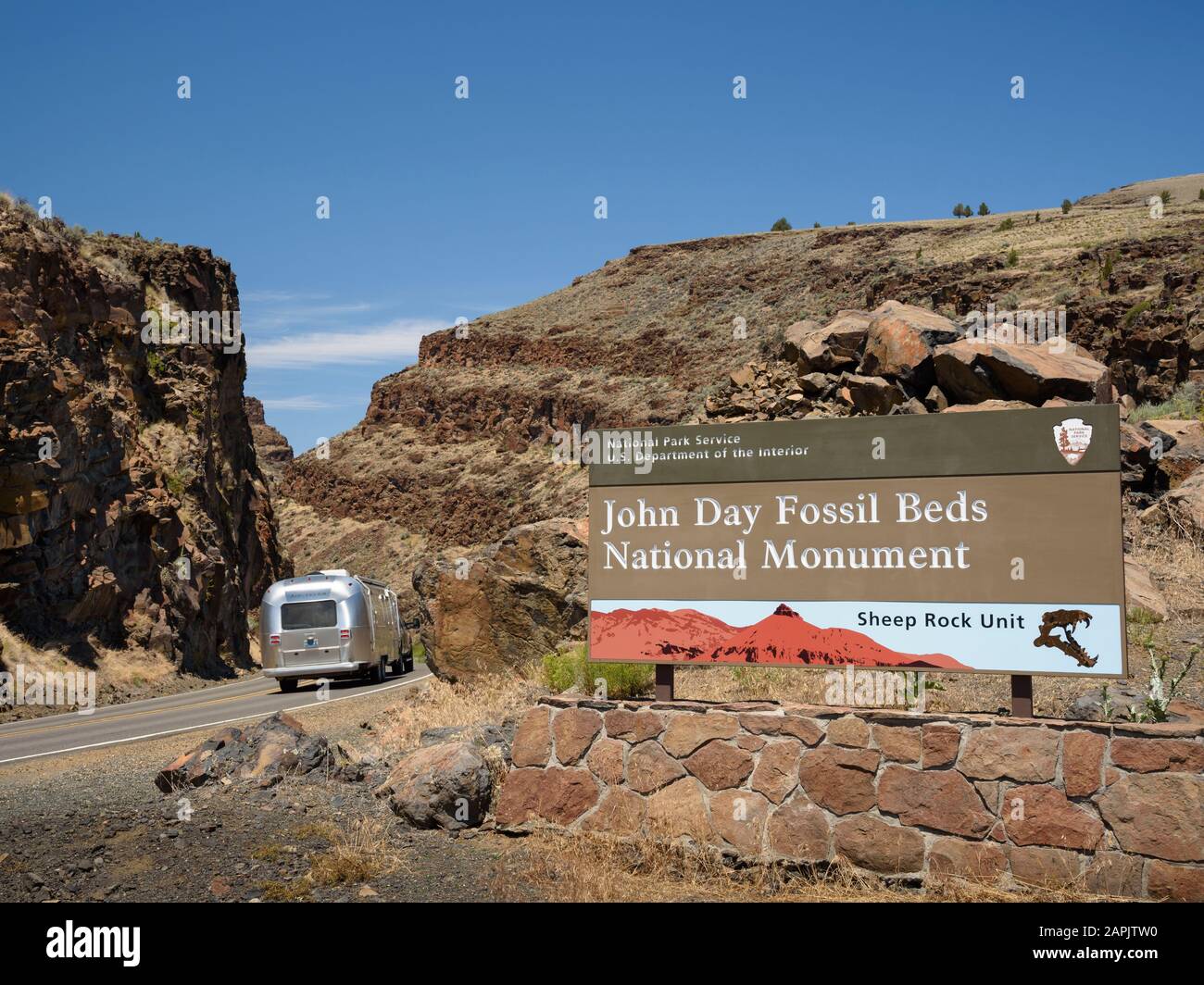 Travel trailer on US Highway 26 in Picture Gorge at the entrance to the Sheep Rock Unit of John Day Fossil Beds National Monument in eastern Oregon. Stock Photo