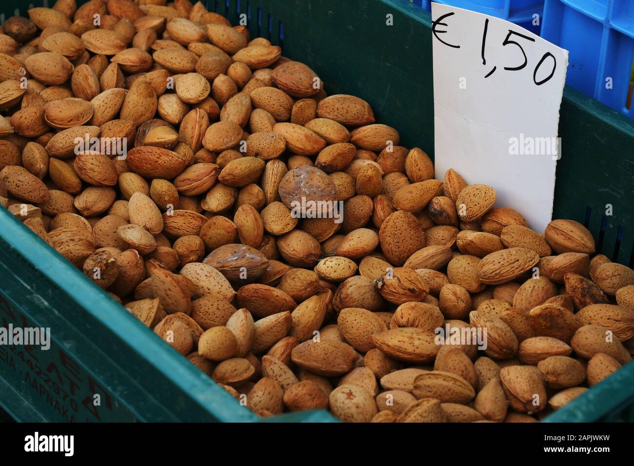 Almonds in shells for sale with price in euro Stock Photo