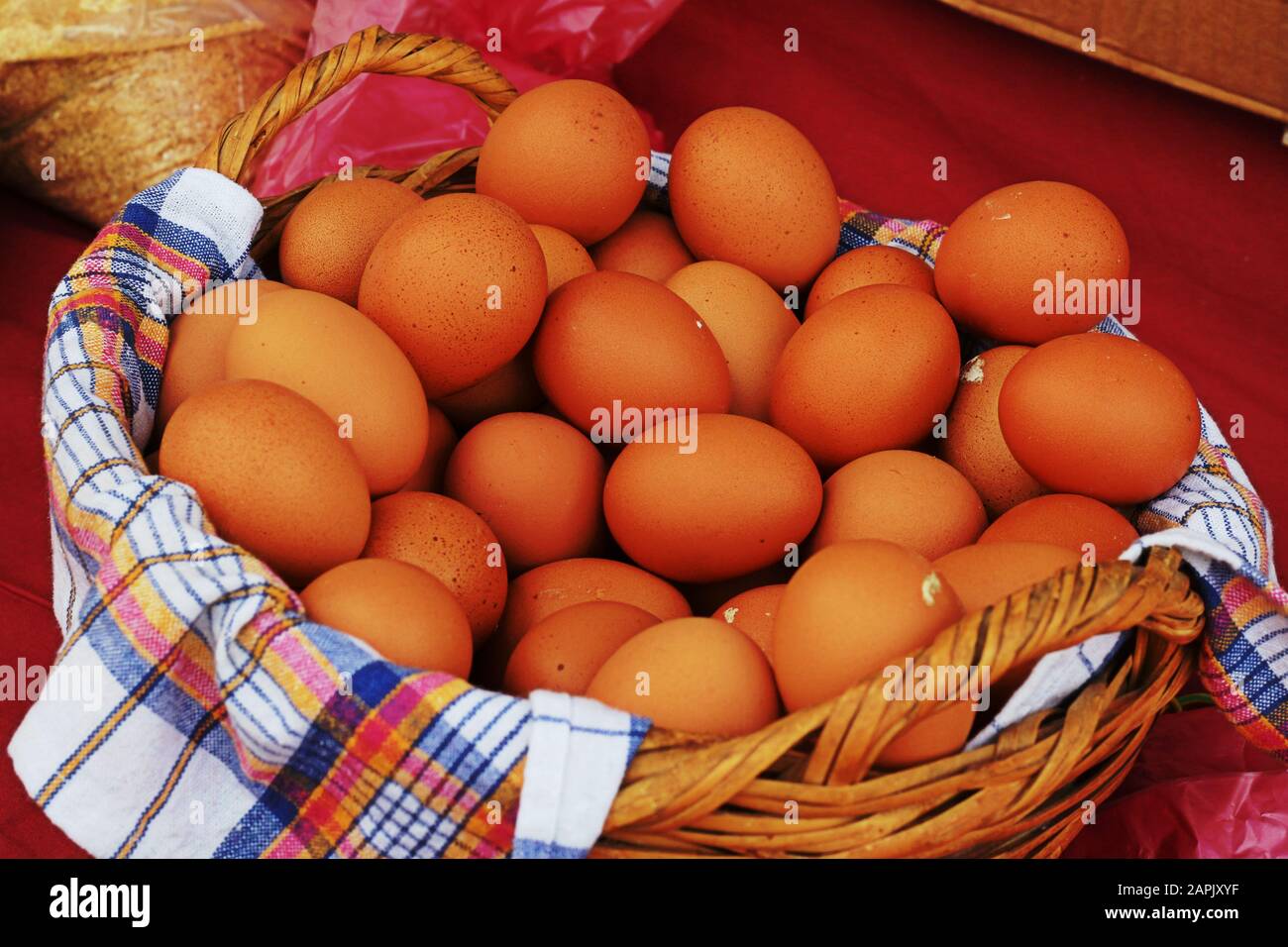 Fresh brown eggs in a wicker basket Stock Photo