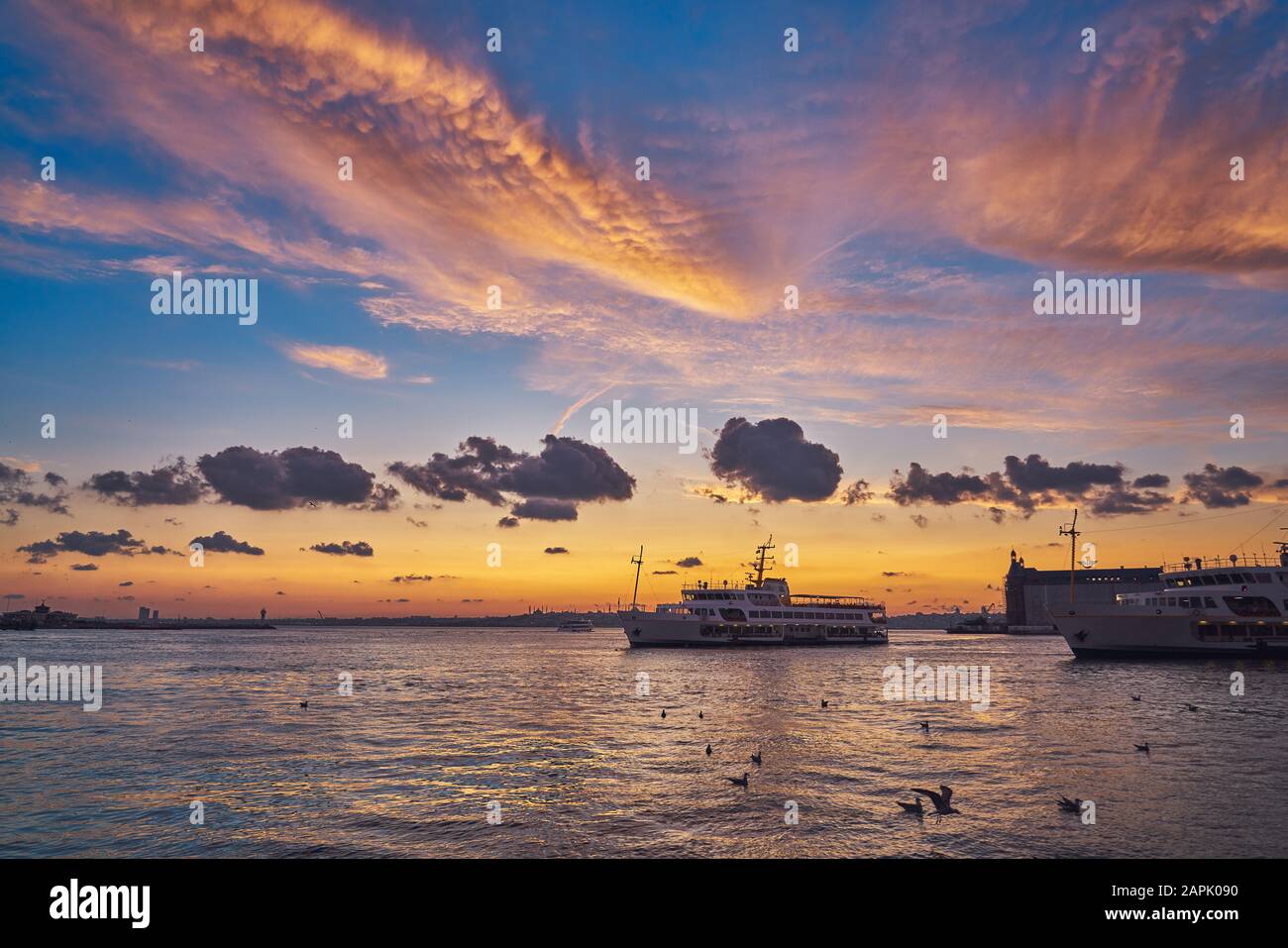 Beautiful sunset in Istanbul, Turkey. Sun is above silhouettes of Hagia ...