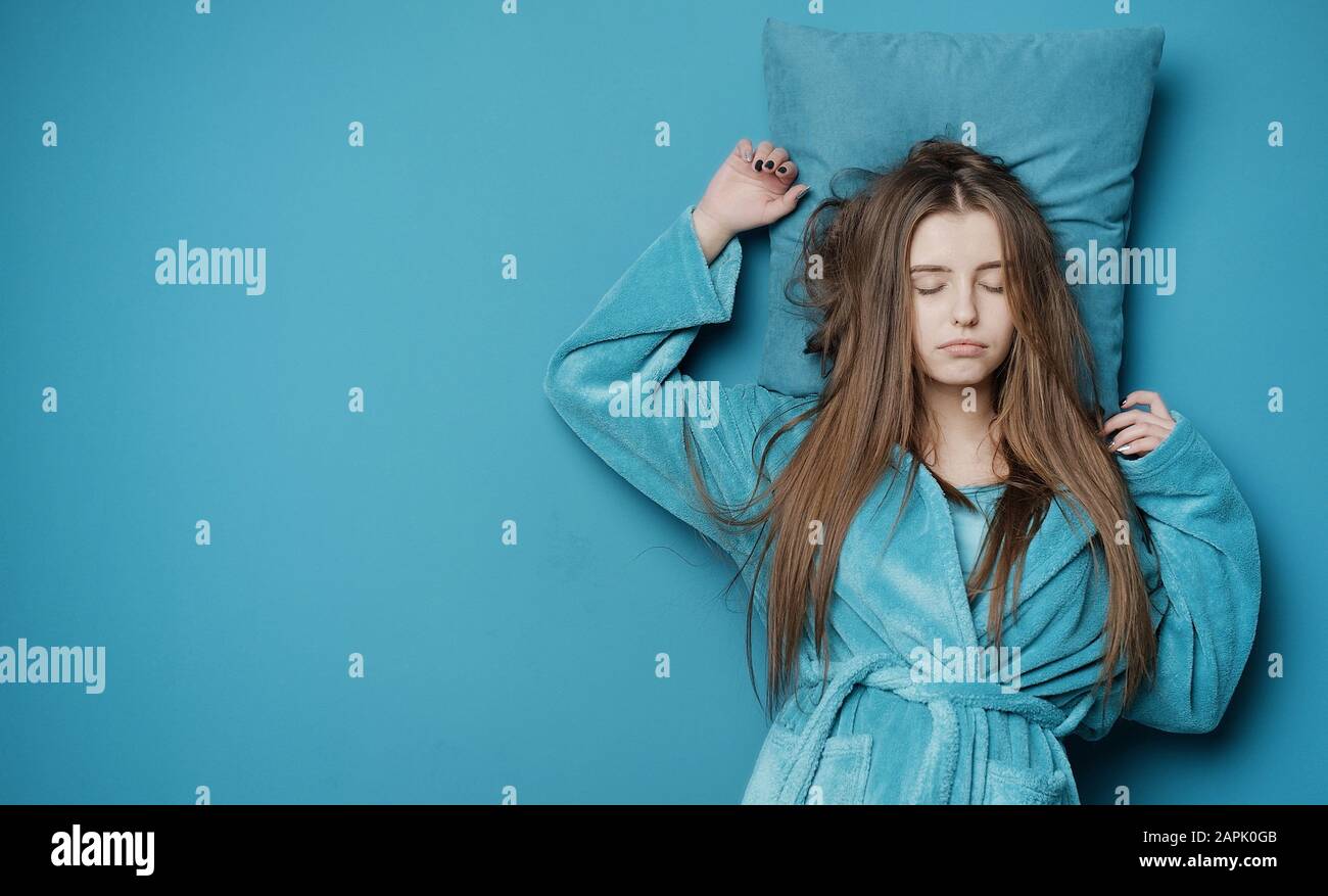 Sleeping woman in bathrobe Stock Photo Alamy