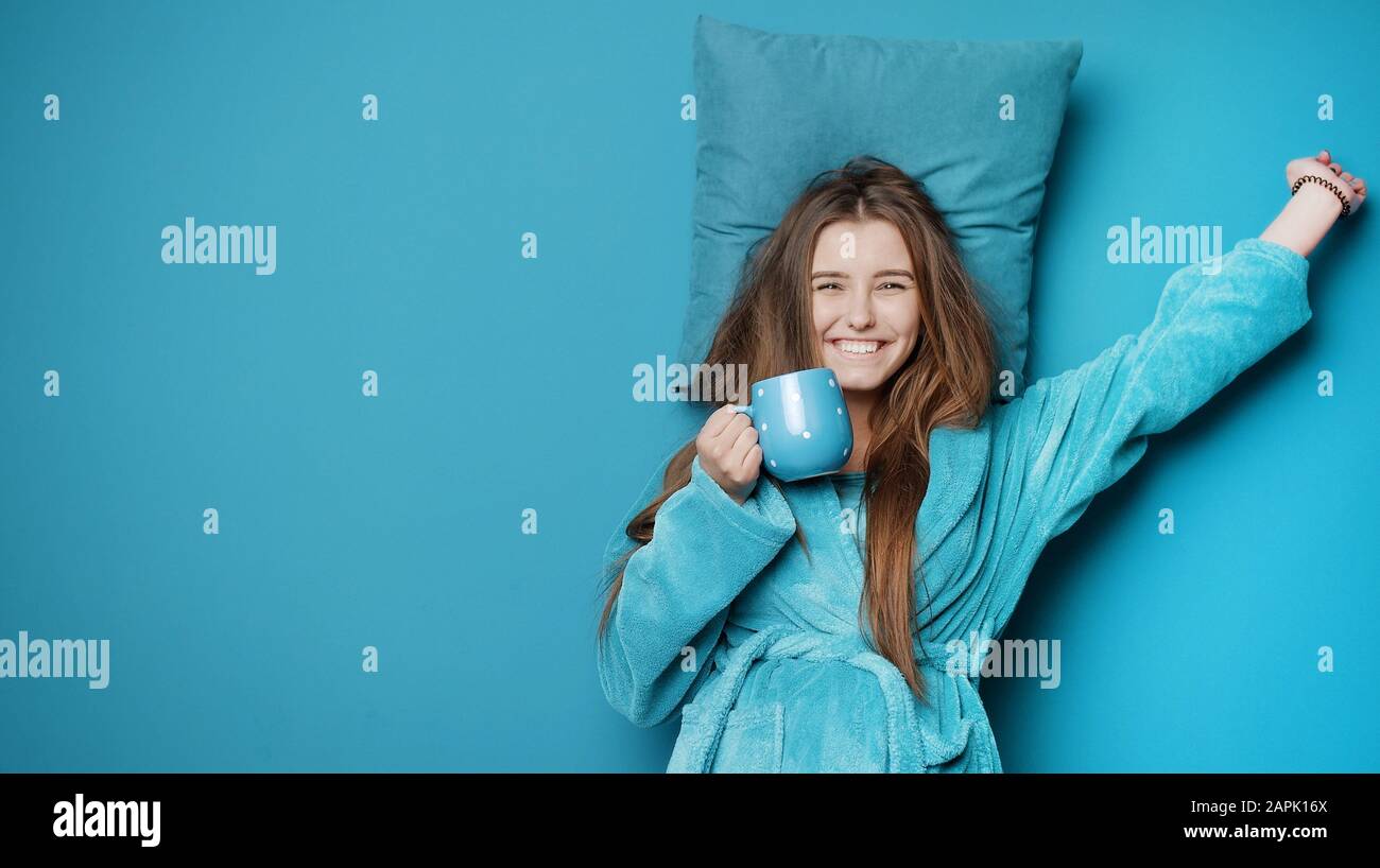 Stretching female with cup Stock Photo