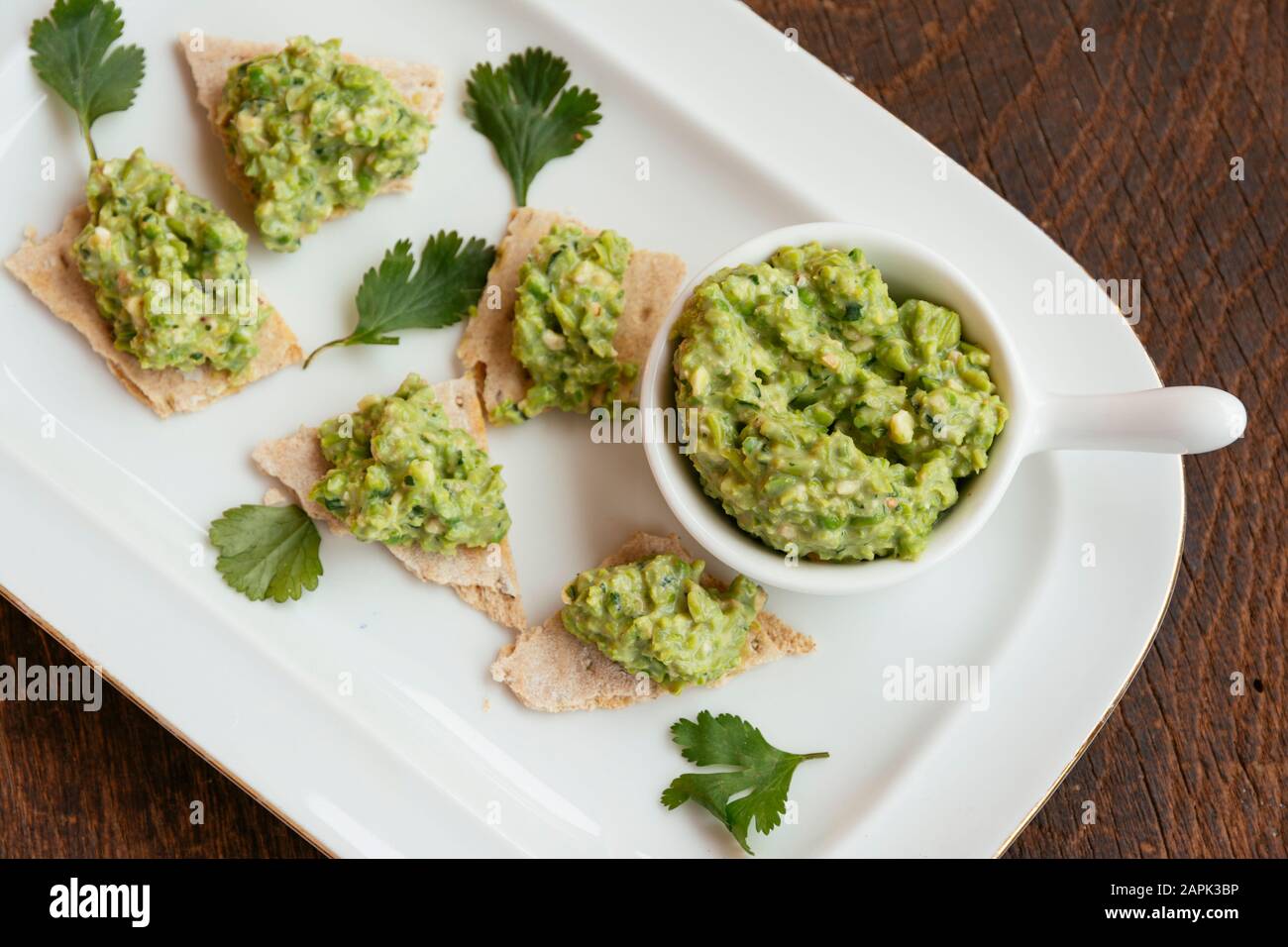 Home made green pea and walnut dip (vegan) Stock Photo