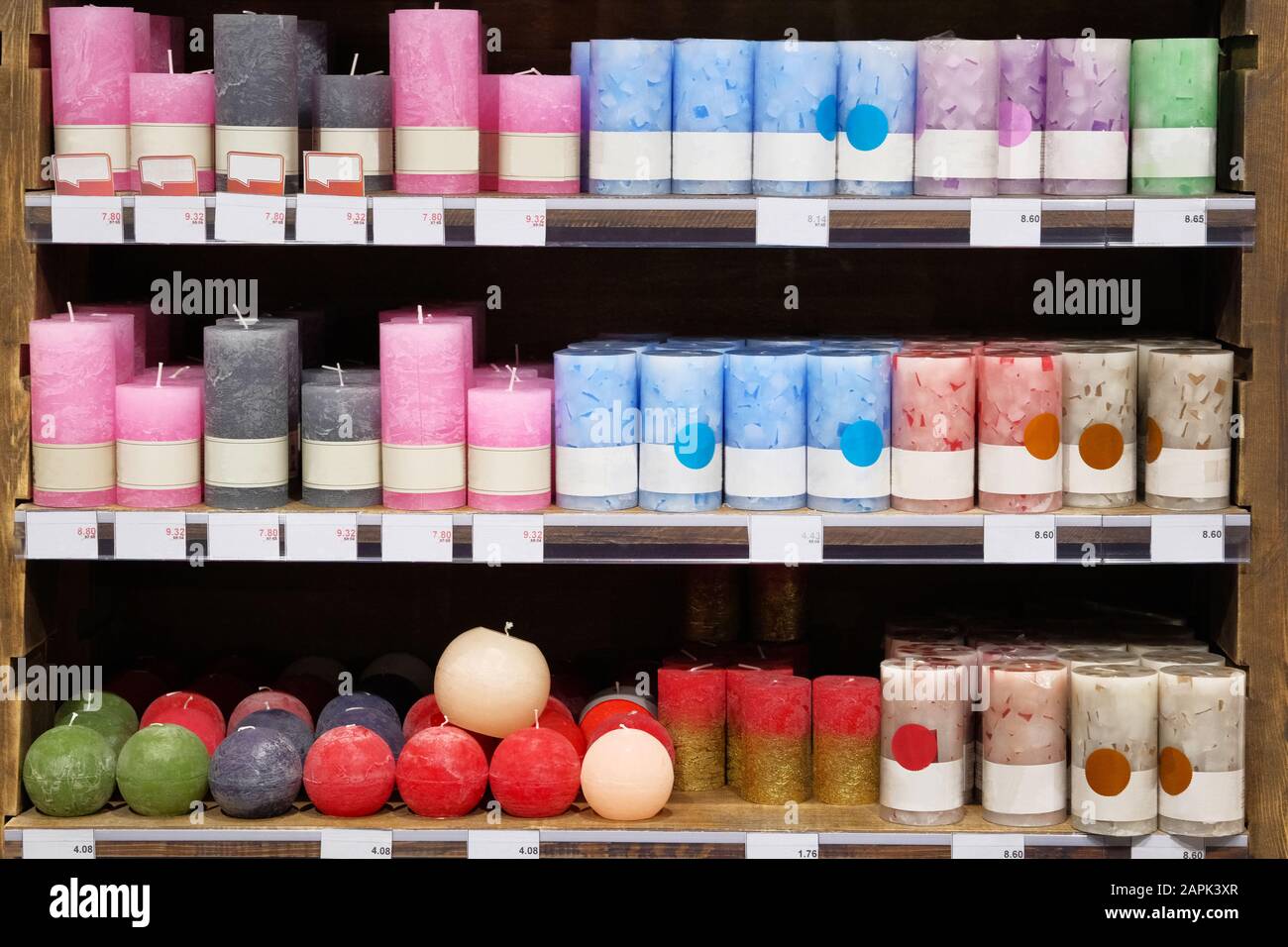 Candles for sale in interior decorating store. Variety coloured aroma  candles in large candle shop. Discounts on price tags, sale Stock Photo -  Alamy